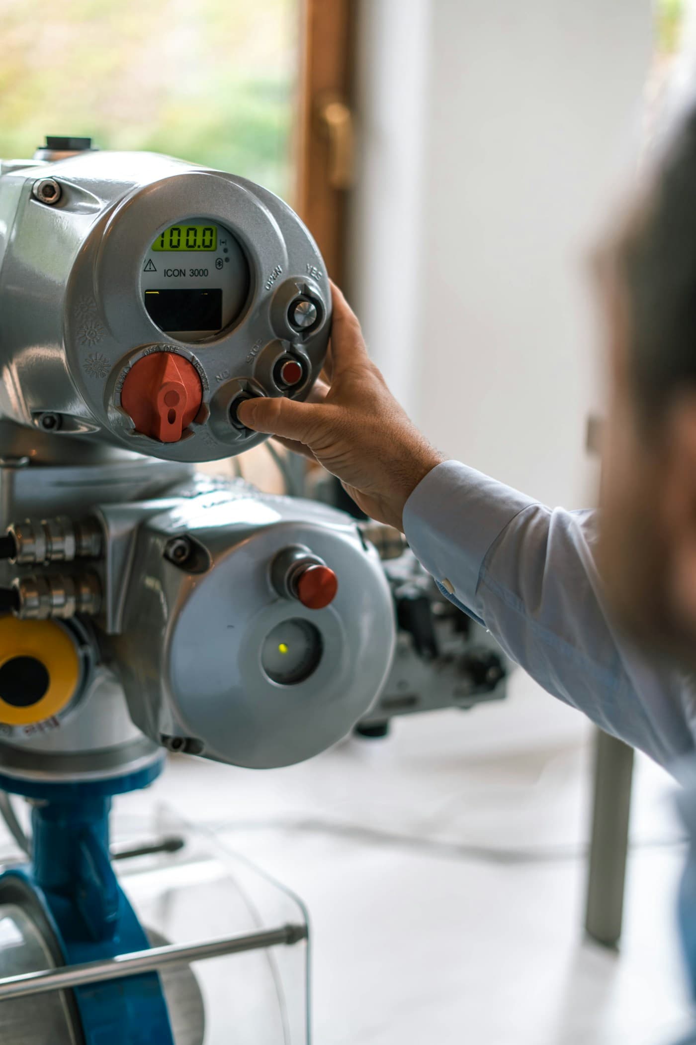 Engineer operating precision industrial equipment